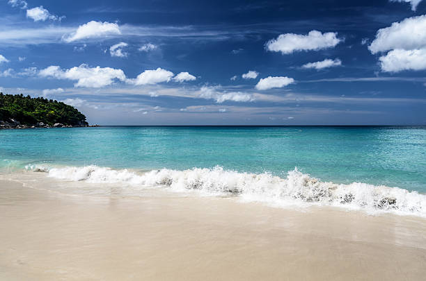 istock Beautiful tropical beach and blue sky 591818118