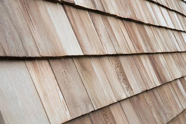 istock Several wood cedar shingles for siding or roofs. 591818208