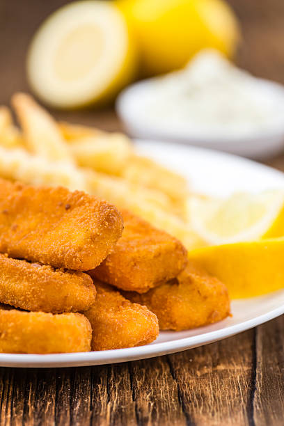 istock Portion of Fish Fingers (selective focus) 591820488