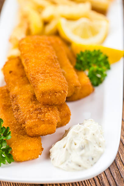 istock Portion of Fish Fingers (selective focus) 591821782