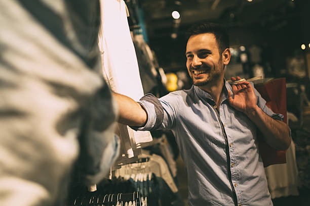 istock Handsome man shopping for clothes 591825696