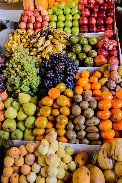 istock Variety of tropical fruit at a market 591827270