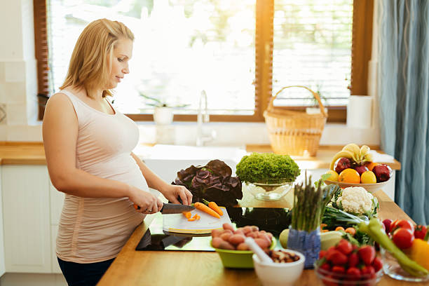 istock Pregnant woman eating healthy 591828596