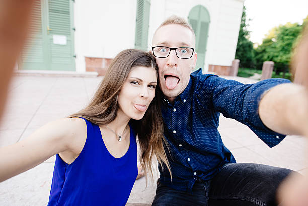 istock Young couple taking self portrait outdoor 591828850
