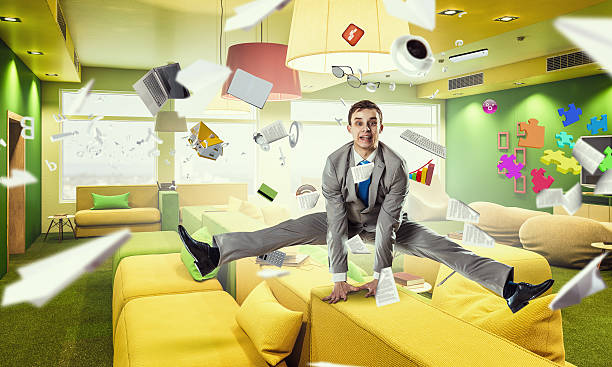 istock Jumping businessman in office . Mixed media 591829850