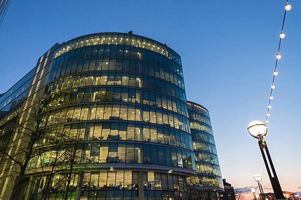istock Low angle view modern glass and steel buildings 591831030