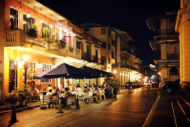 Casco Viejo Nightlife Panama City, Panama - October 20, 2014: Visitors and locals alike enjoy dining in the quaint and historic surroundings along the streets of Panama's old quarter. panama city panama stock pictures, royalty-free photos & images