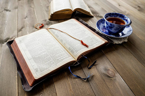 istock Bibles and cup of tea on wood table 591833462