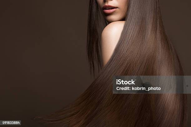 Beautiful Brunette Girl In Move With A Perfectly Smooth Hair Stock Photo - Download Image Now