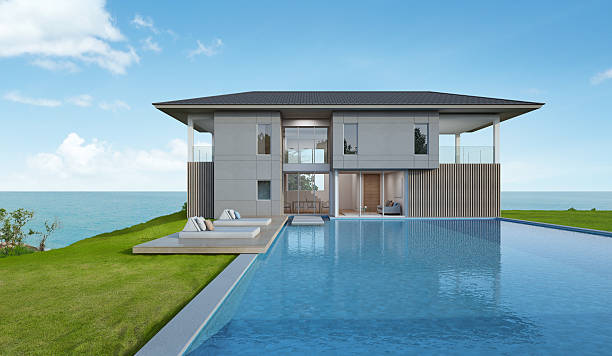 istock Beach house and pool with sea view in modern design 591833892