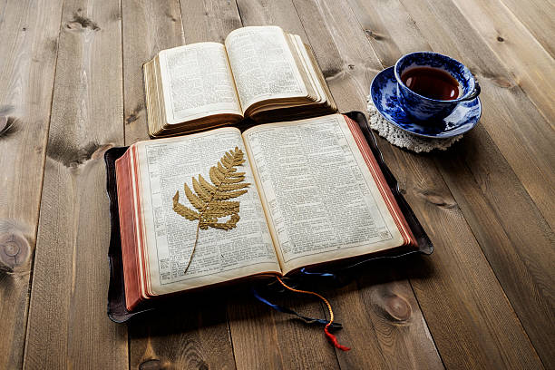 istock Two open Bibles and cup of tea 591834058