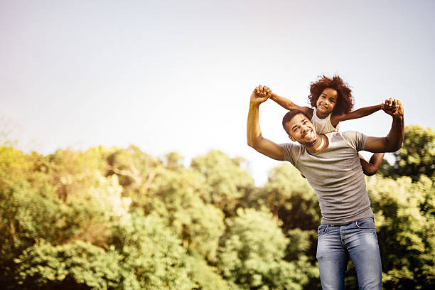 istock Father carrying daughter piggyback 591834828