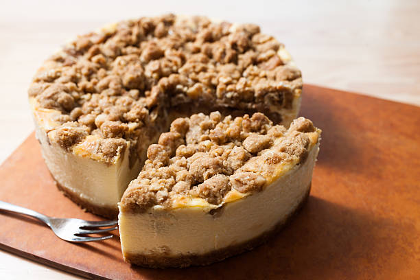 istock Homemade Apple Crumble Cheese Cake on wooden table. 591838600