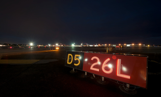 Airport taxiway signage at night