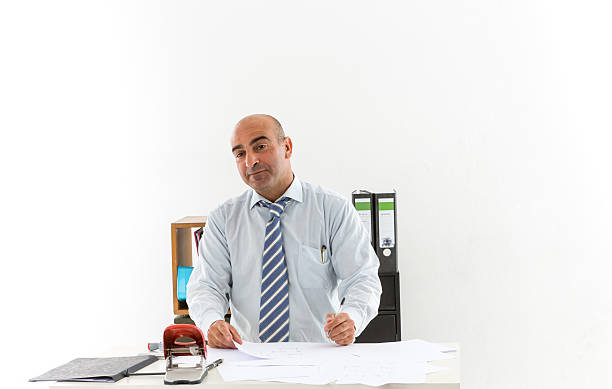 istock Bald bureaucrat at work with facial expressions 591843938