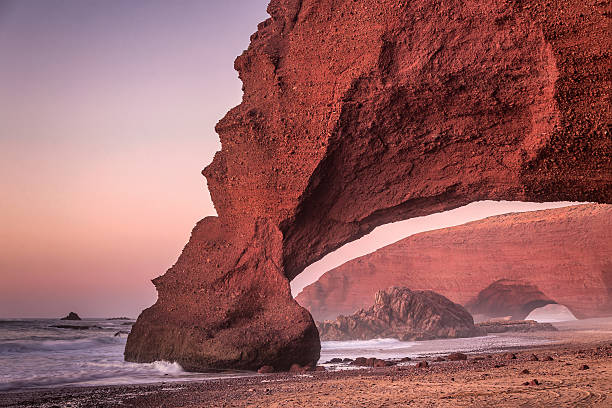 istock Red arches of Legzira beach 591844046