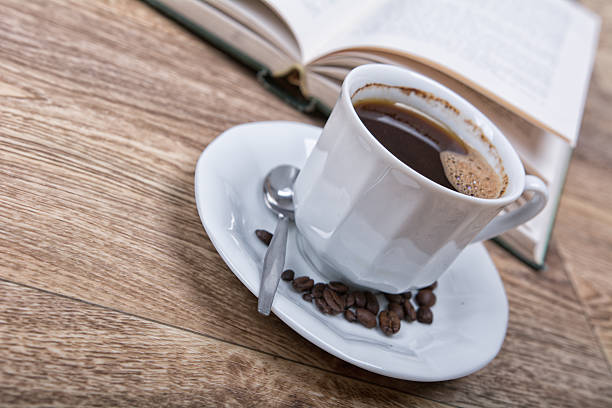istock cup of coffee with a book 591844890
