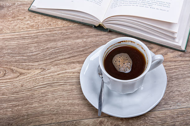 istock cup of coffee with a book 591844950