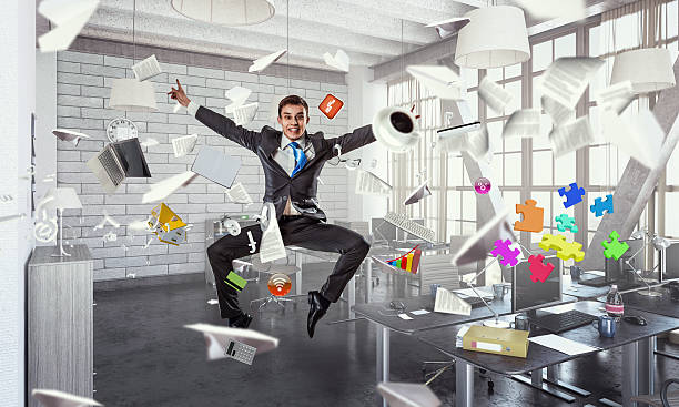 istock Jumping businessman in office . Mixed media 591846274