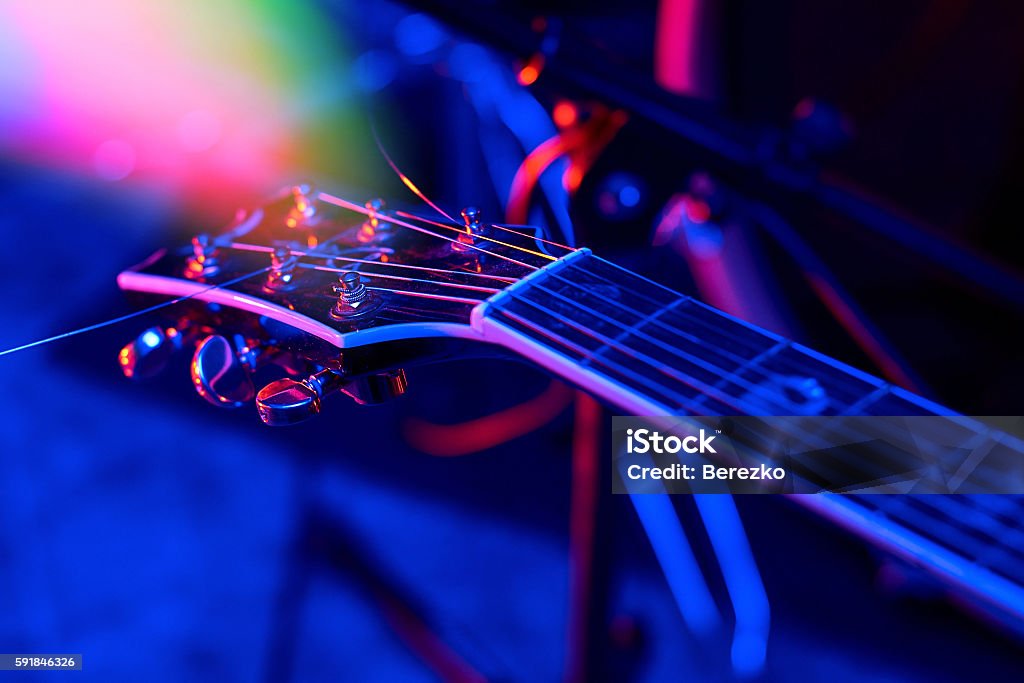 Guitar at the concert Guitar at the concert in colorful light. Music Stock Photo