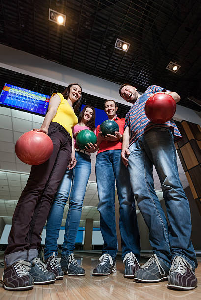 Friends having fun in bowling