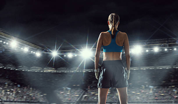 istock Young boxer woman at ring . Mixed media 591847008