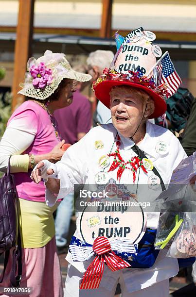 Antitrump Protester Sells Dump The Trump Buttons Stock Photo - Download Image Now