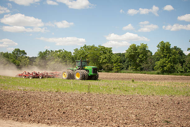 John Deere Tilling Field stock photo