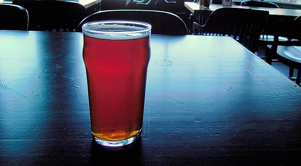 istock Pint of beer on table 591847826