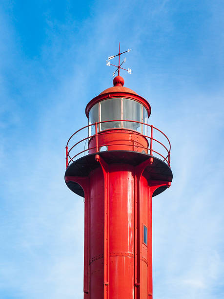 istock Old red lighthouse in Lisbon, Portugal 591848036
