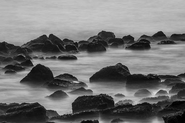 istock Lava Rocks in Ocean Waves 591849070