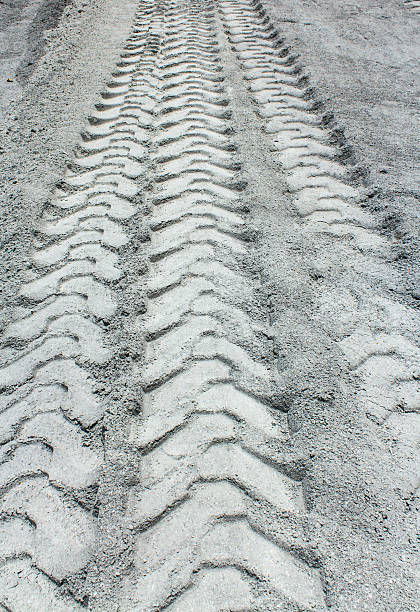 istock Tire track on muddy road 591850248
