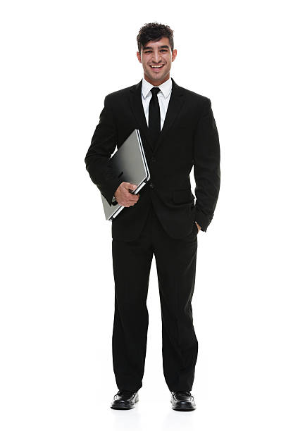 istock Smiling businessman standing and looking at camera 591850384