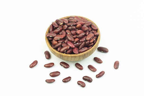 istock red beans in brown wooden bowl isolated on white background 591850894