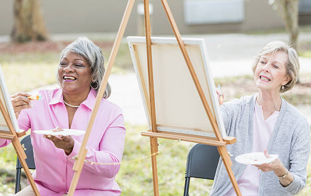 istock Multi-ethnic senior women taking an art class 591852364