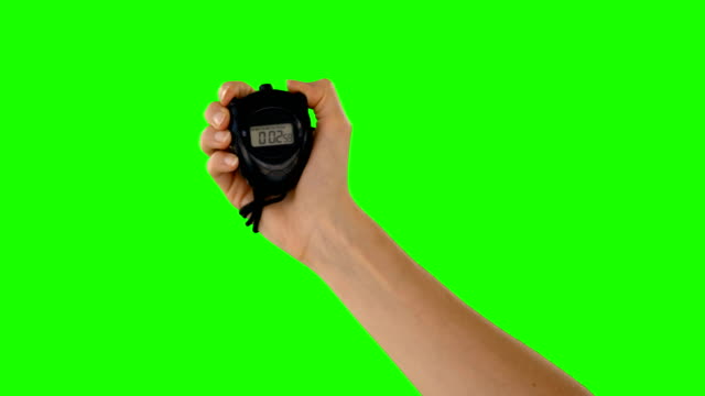 Hand holding a stopwatch