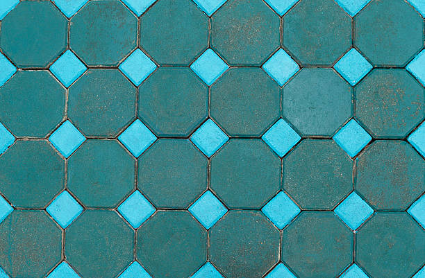 istock Closeup colour cement block floor 591990596