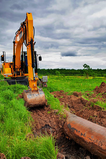 istock Excavator working near gas pipelines 591991700