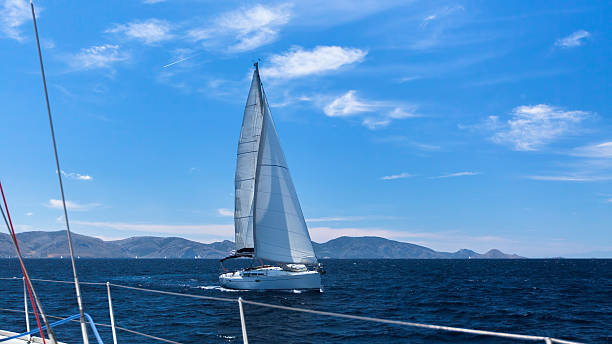 istock Sailing regatta in the wind through the waves. Luxury yachts. 591992466