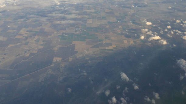 istock Aerial view of clouds and greenery 591992660
