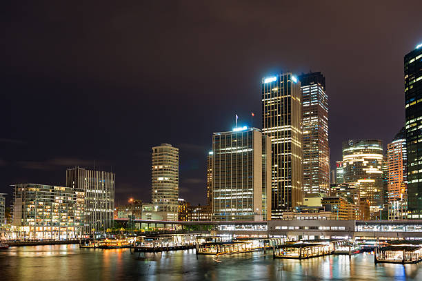 istock Circular Quay ferry and railway station with skyline at night 591993086