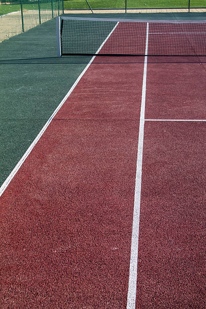 istock Tennis field with red and white lines 591994074