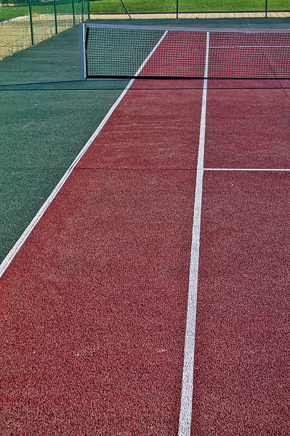 istock Tennis field with red and white lines 591994120