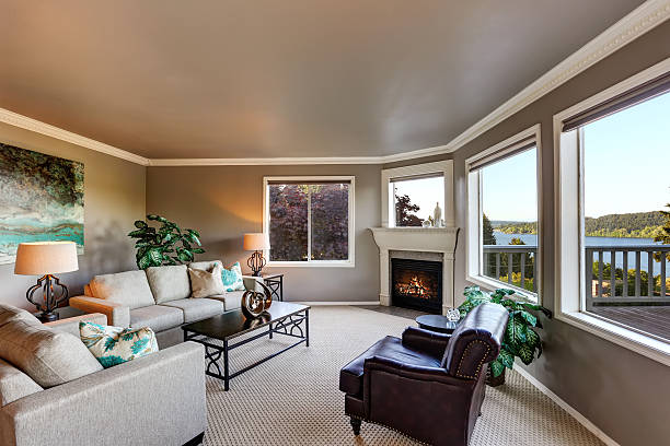 istock Cozy living room interior with fireplace and black coffee table. 591995592