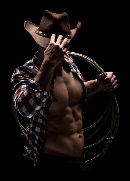 istock Muscular cowboy giving a pose 591995750