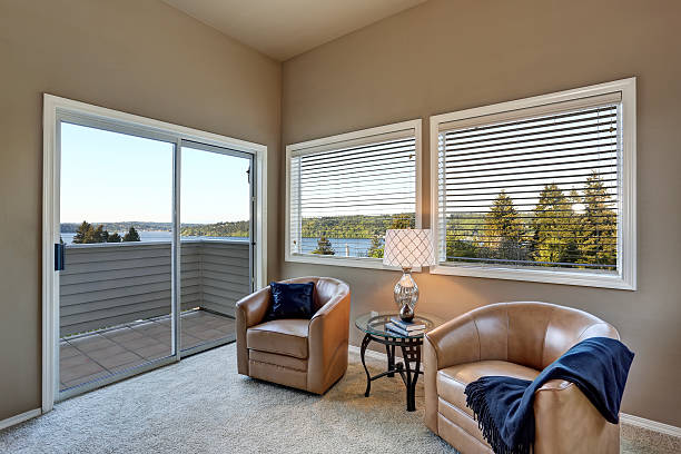 istock Rest area in the bedroom with two armchairs, water view 591996138