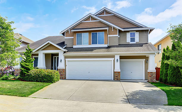 istock Classic American house exterior with siding trim and garage. 591996232