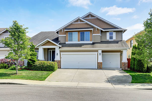 istock Classic American house exterior with siding trim and garage. 591996270
