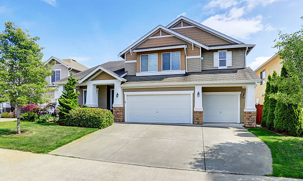 istock Classic American house exterior with siding trim and garage. 591996302