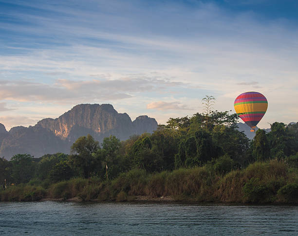 istock Hot air balloon high in the sky 591997042